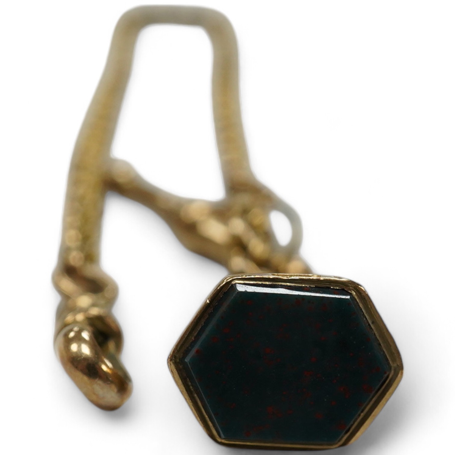 A late Victorian 9ct albert, hung with a late Victorian 9ct gold and bloodstone set fob seal, 23cm, gross weight 12.2 grams. Condition - fair